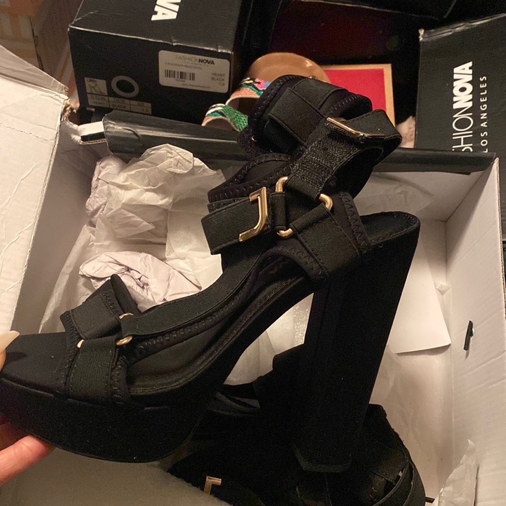 Black and gold heels with straps. Only worn once.